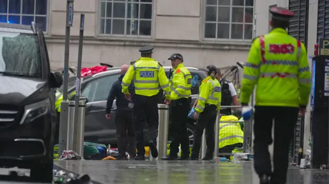 Police and emergency personnel dealing with a road traffic accident on Water Street near the Liver Building in Liverpool after a car collided with pedestrians during the Premier League winners parade. A man has been detained. Picture date: Monday May 26, 2025