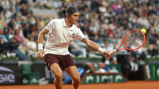 Mattia Bellucci plays a backhand