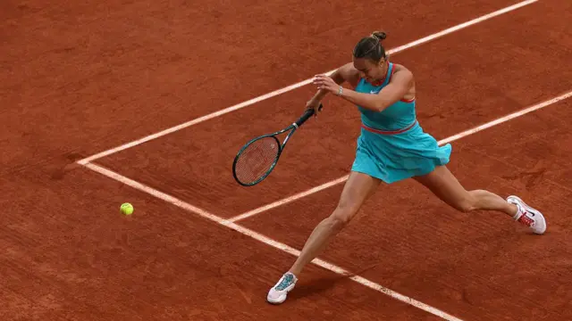 Aryna Sabalenka runs after the ball