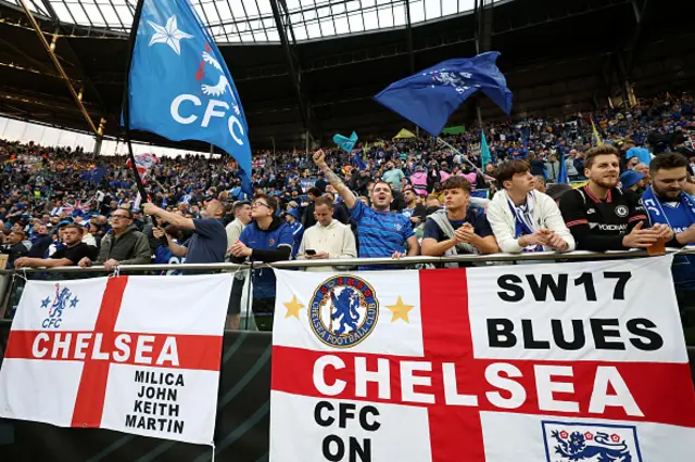 Fans of Chelsea display banners featuring the St George cross and show support