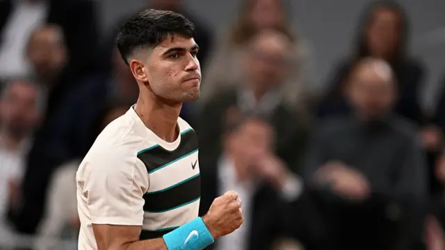 Carlos Alcaraz reacts to a point