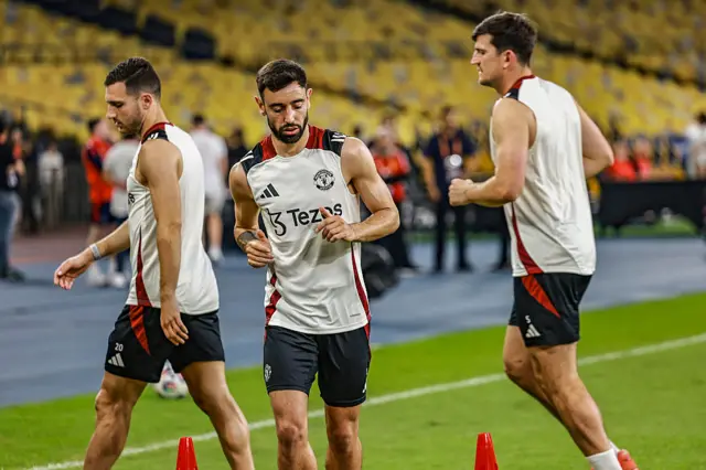 Diogo Dalot, Bruno Fernandes and Harry Maguire in training