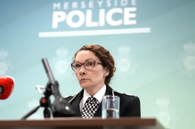 A file photo of assistant chief constable Jenny Sims from Merseyside Police speaking at a press conference on Tuesday. She is seated in front of a microphone and wearing a uniform