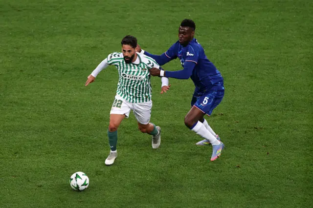 Isco of Real Betis is challenged by Benoit Badiashile