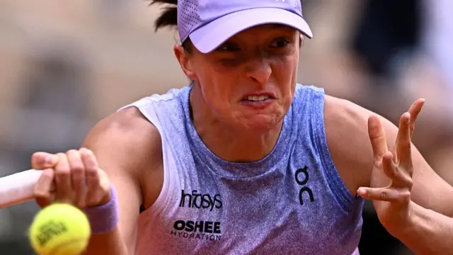 Iga Swiatek plays a forehand return