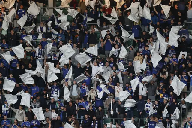 Chelsea fans wave flags ahead