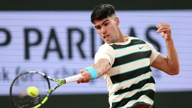 Carlos Alcaraz plays a forehand