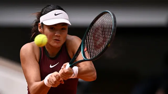 Emma Raducanu plays a backhand return