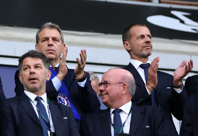 Chelsea co-owner Behdad Todd Boehly speaks with UEFA President Aleksander Ceferin