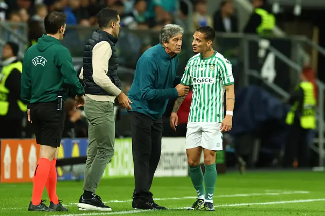 Real Betis Manager Manuel Pellegrini speaks to Antony of Real Betis