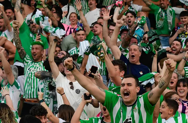 Real Betis supporters react after Real Betis' Moroccan forward Abde Ezzalzouli scored the opening goal