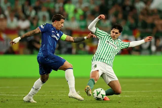 Enzo Fernandez of Chelsea is challenged by Johnny Cardoso