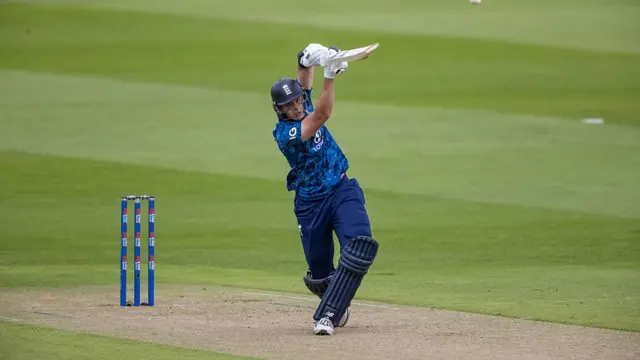 Jamie Smith of England hits the ball to the boundary