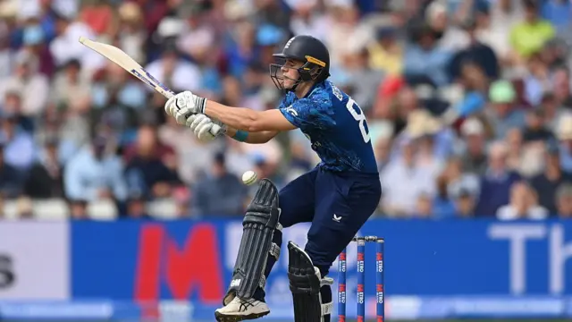 Jacob Bethell of England is struck by the ball