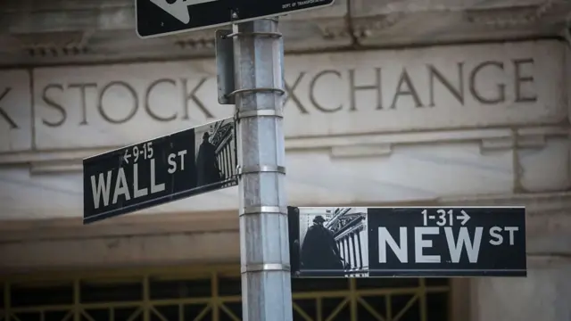 New York Stock Exchange signs show way to New Street and Wall Street