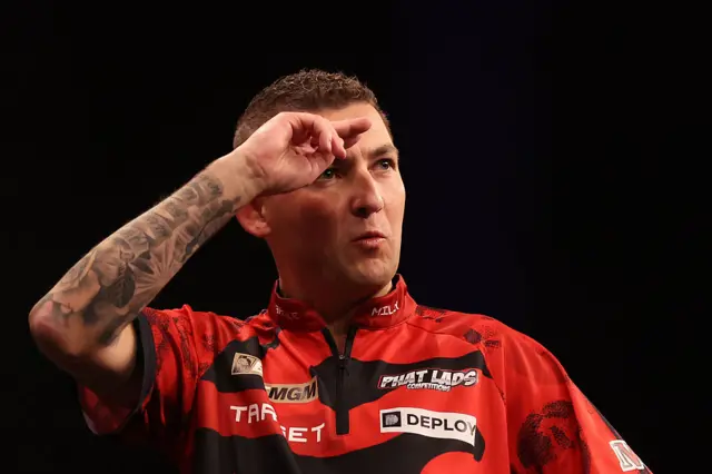 Nathan Aspinall salutes the crowd