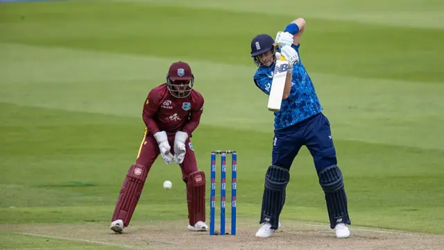 Joe Root of England punches the ball off of his back foot