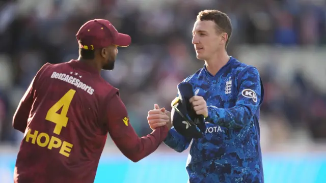 England's Harry Brook (right) and West Indie's Shai Hope shake hands during the First Men's One Day International match at Edgbaston,
