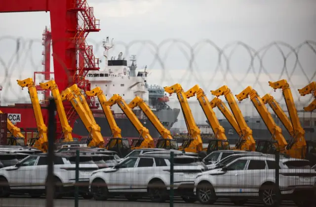 Cars and JCs are seen lined up for export at Seaforth Dock container terminal in Liverpool
