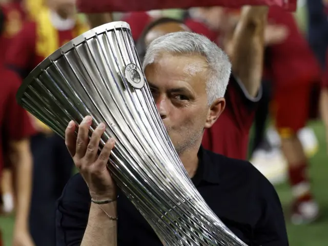 Jose Mourinho kissing the Conference League trophy
