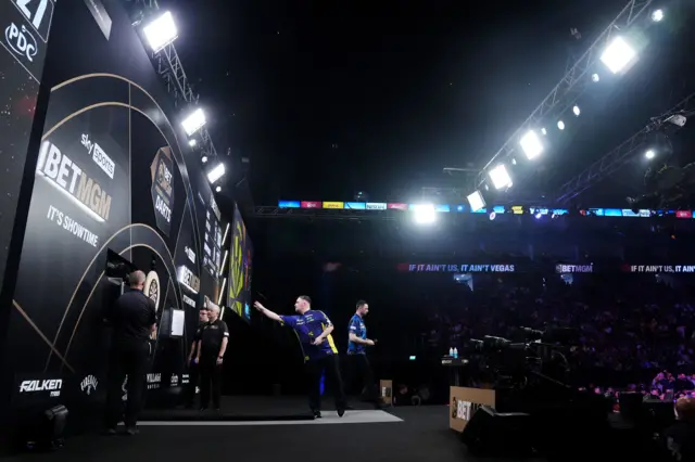 A general view of Luke Littler (left) in action against Luke Humphries during the final of the BetMGM Premier League Play-Offs at The O2, London