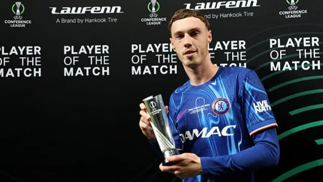 Cole Palmer with the player of the match trophy