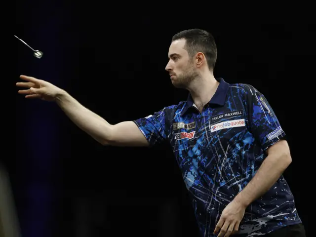 Luke Humphries in action during his semifinal match against Nathan Aspinall
