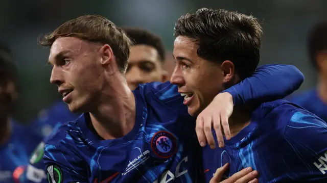 Cole Palmer congratulates Enzo Fernandez after creating his goal in the 2025 Conference League final