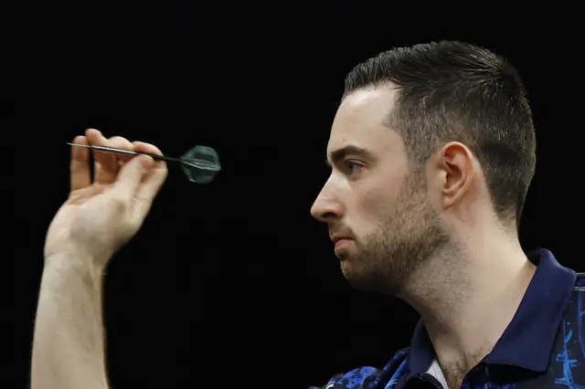 Luke Humphries in action during his semifinal match against Nathan Aspinall