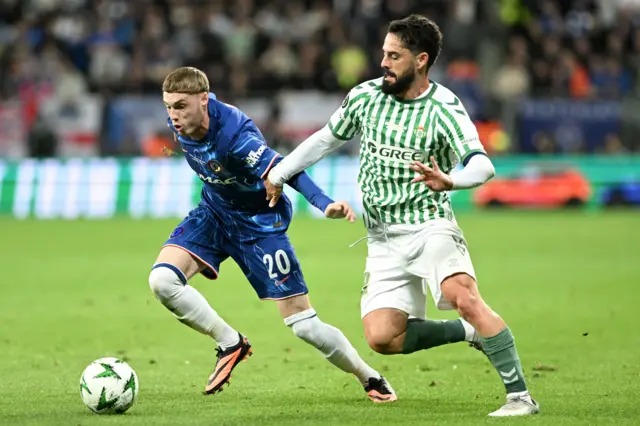 Cole Palmer and Isco running for the ball in the 2025 Conference League final