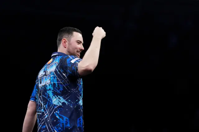 Luke Humphries celebrates during his match against Nathan Aspinall during the BetMGM Premier League Play-Offs at The O2, Londo