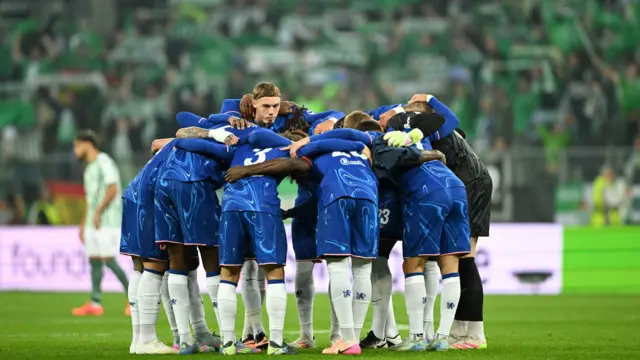 Cole Palmer in a huddle with his Chelsea team-mates before the 2025 Conference League final