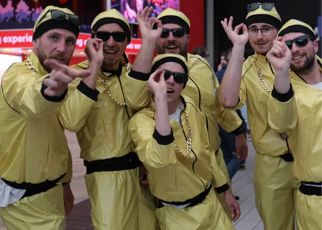 A group of spectators dressed as Ali G at the Premier League Darts play-offs at O2 Arena