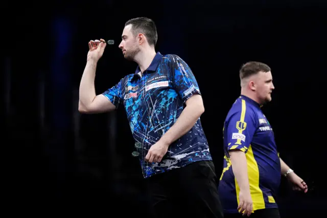 Luke Humphries (left) in action against Luke Littler during the final of the BetMGM Premier League Play-Offs at The O2, London
