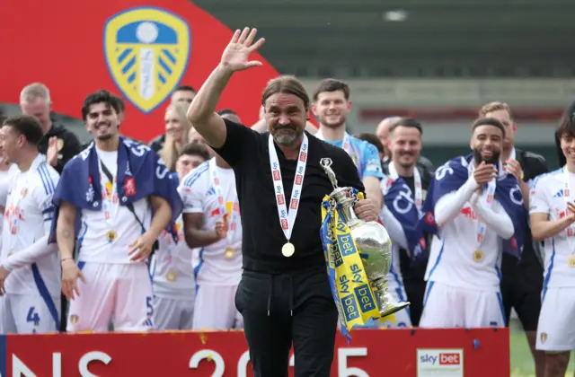 Leeds boss Daniel Farke with the Championship trophy