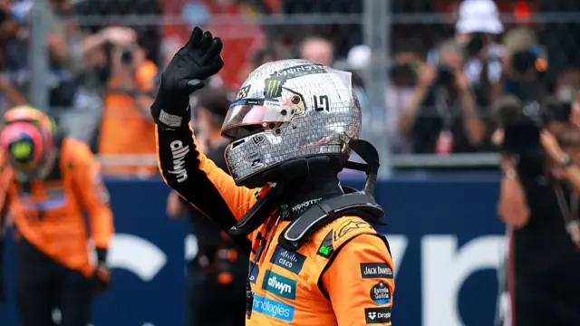 Lando Norris waves at fans after the Miami Sprint race