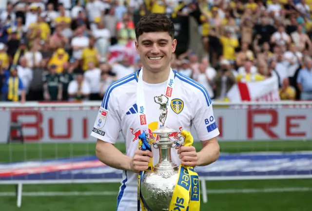 Dan James with the Championship trophy