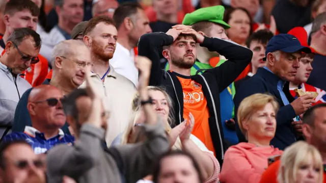 Luton fans look dejected after relegation