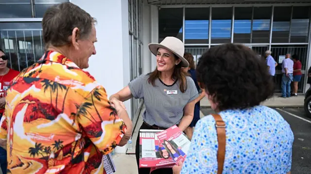 Labor's candidate for the seat of Dickson, Ali France, greets voters at an early voting centre on 23 April 2025