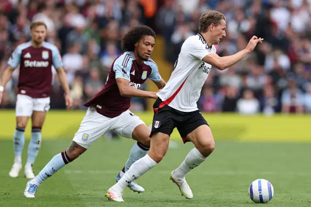 Sander Berge (R) runs away from Aston Villa's French midfielder Boubacar Kamara