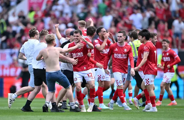 Bristol City players celebrate securing a play-off spot