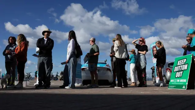 People queue up outside a polling station at Bondi Beach on in Sydney on 3 May 2025