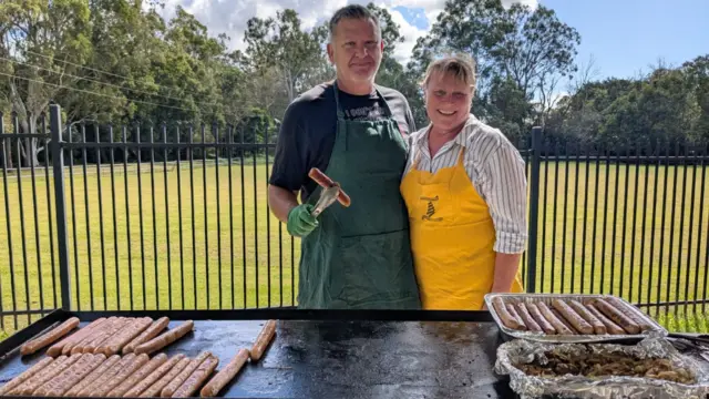 Dickson resident Michelle and her husband Thor running the democracy sausages barbecue