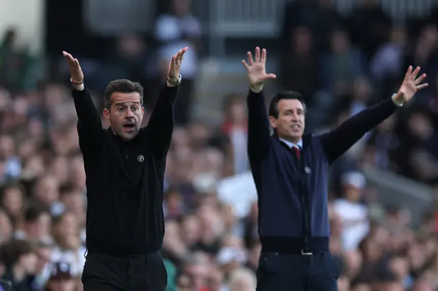 Marco Silva, Manager of Fulham, reacts alongside Unai Emery