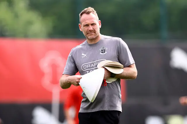 Southampton interim boss Simon Rusk holding cones