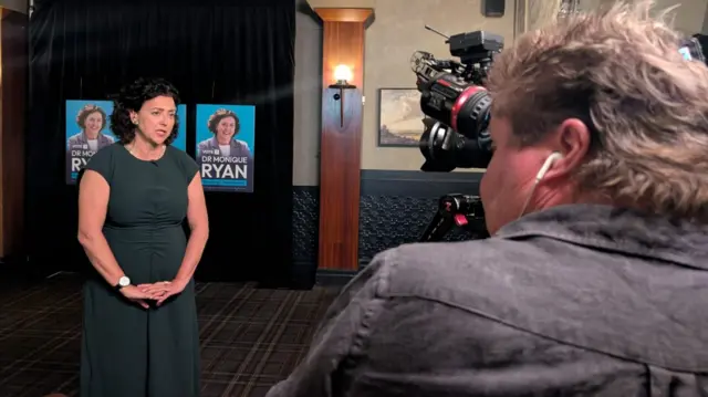 Monique Ryan speaking to a camera at her election night party in Melbourne