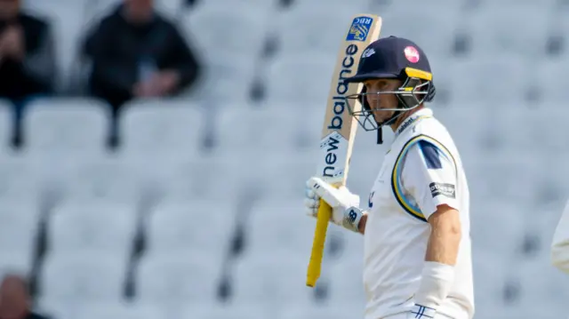 Joe Root celebrates scoring 50