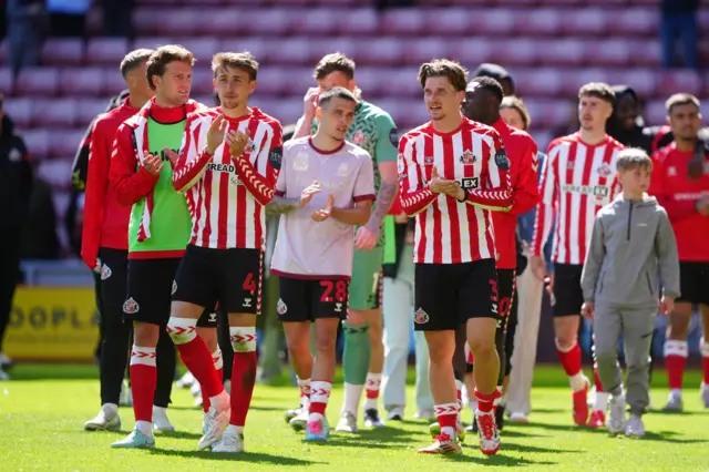 Sunderland players clap the fans after full-time against QPR