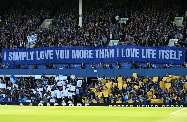 Everton fans hold a banner