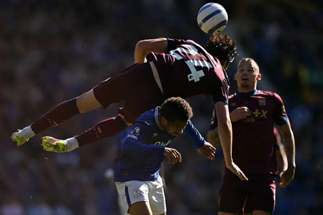 Jacob Greaves heads the ball